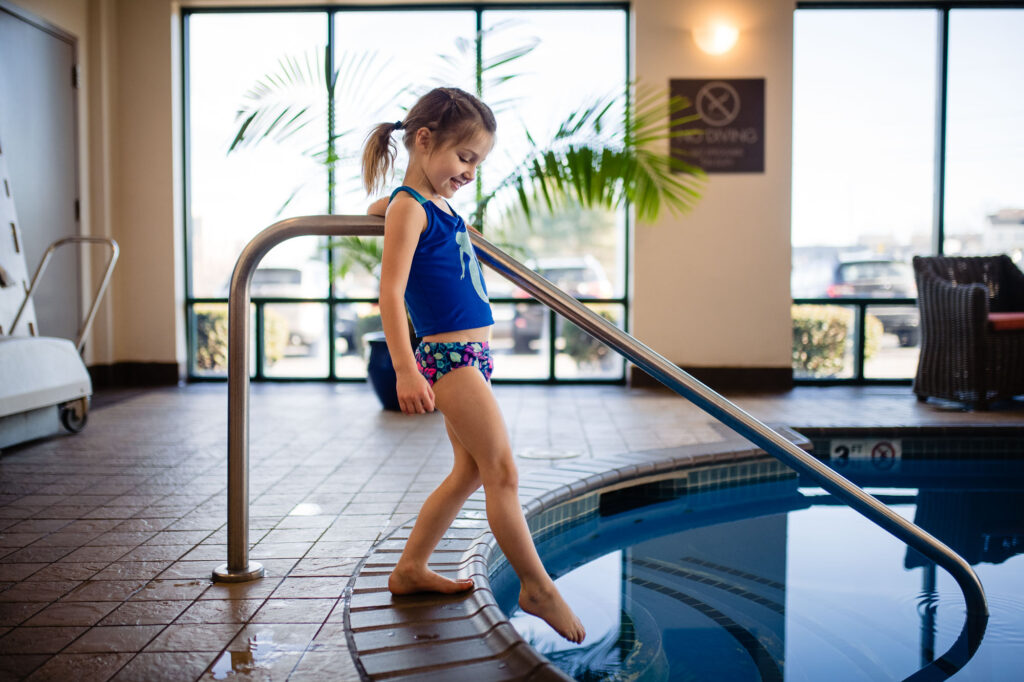 guest swimming in pool inside Comfort Inn & Suites Logan International Airport